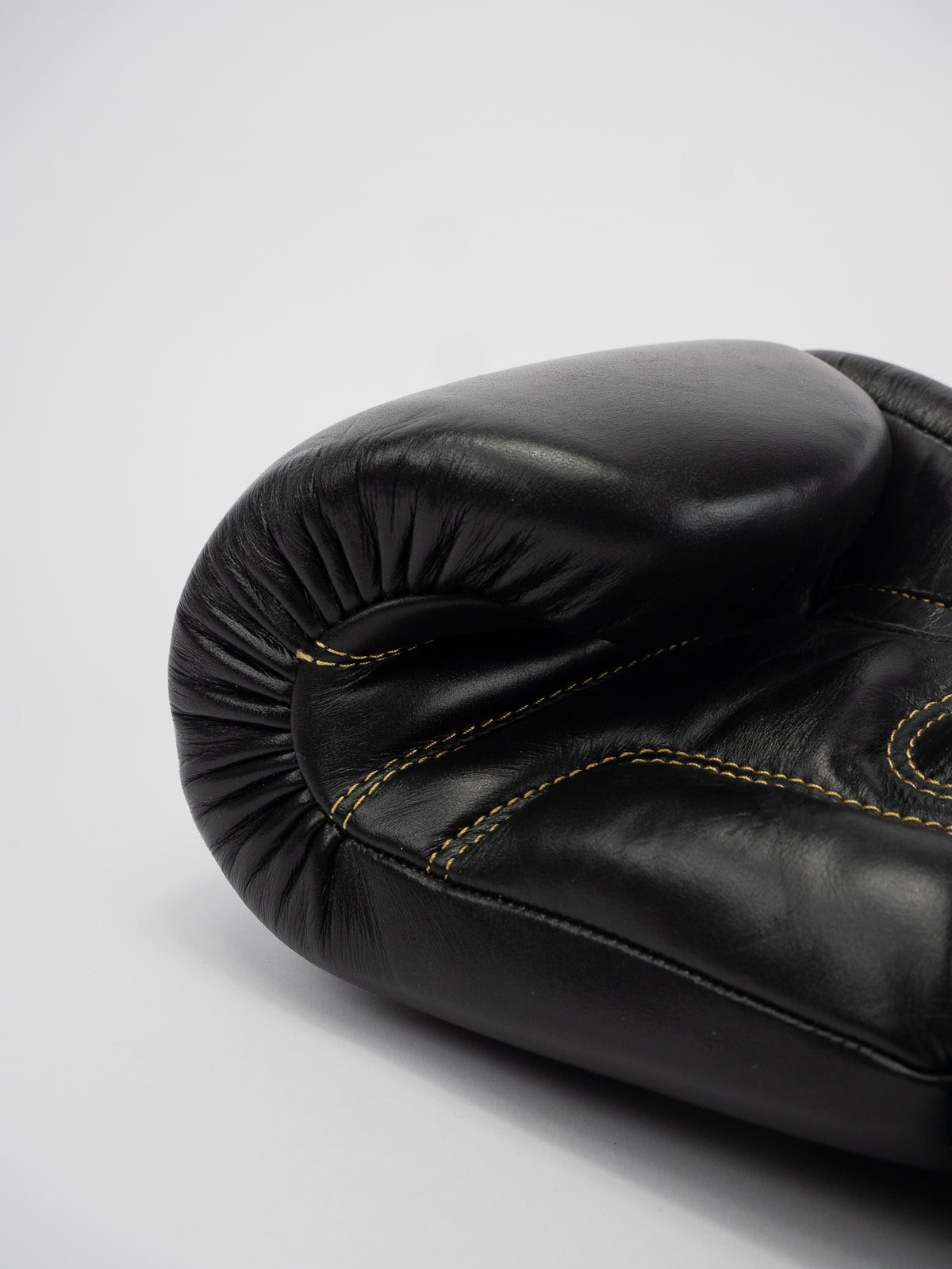 THAI SERIES BLACK GOLD LEATHER BOXING GLOVES